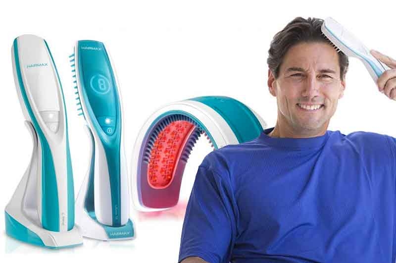 Man use HairMax LaserComb