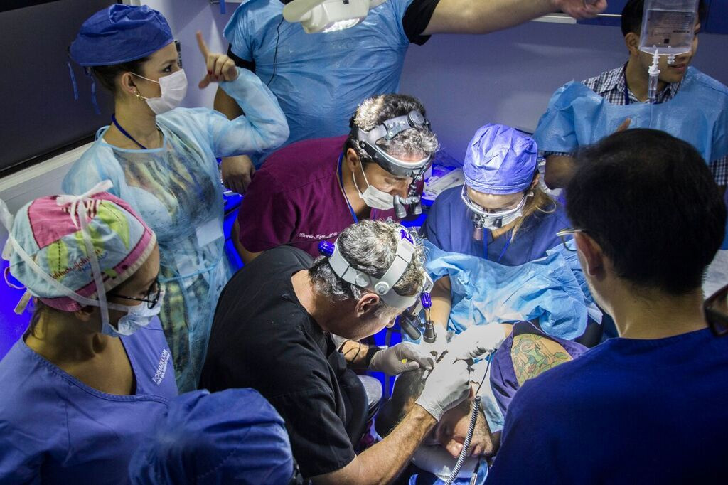 A surgeon performing a hair transplant procedure