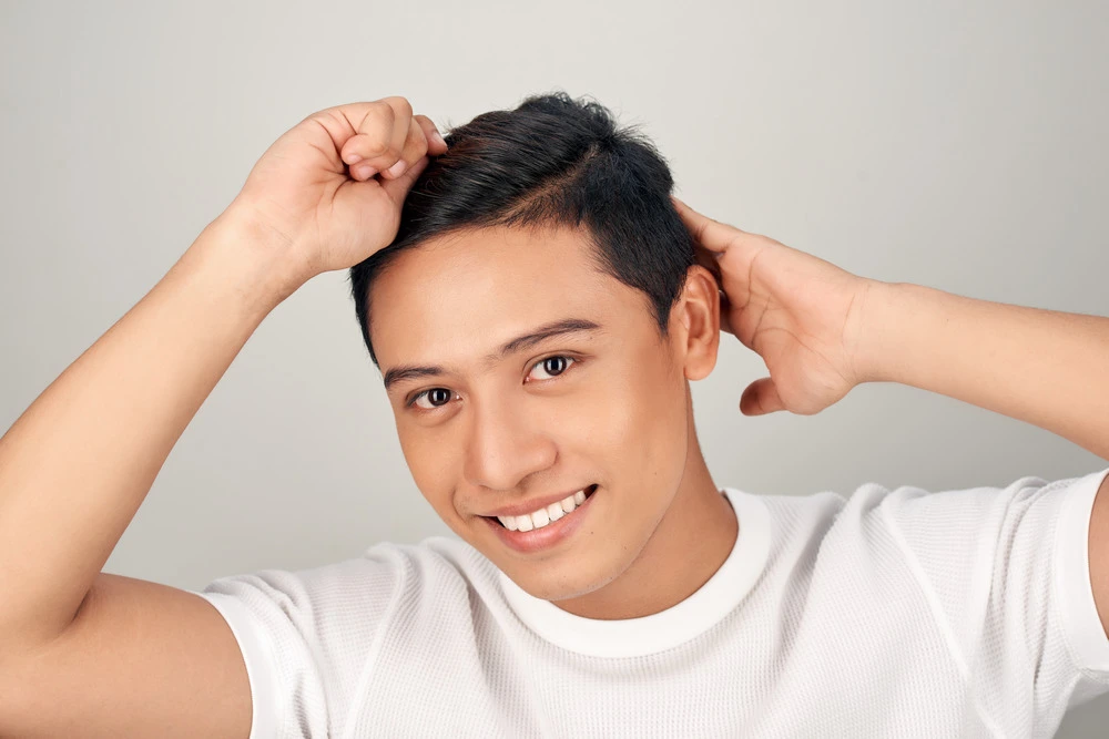 Man brushing his hair