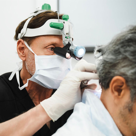 Dr. John P. Cole, MD in hair transplant surgery operation