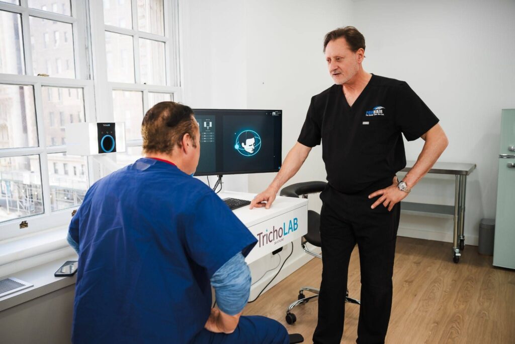 Dr. John P. Cole and an associate in the Forhair NYC clinic.